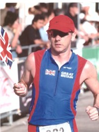 I might not be looking too good here...but I'm telling you...that is waaaaaaay better than I was feeling. I'm actually asking myself if I think I can make the last few yards before puking..again! Thanks once again to our Team Manager Ian Pettitt for the flag :)